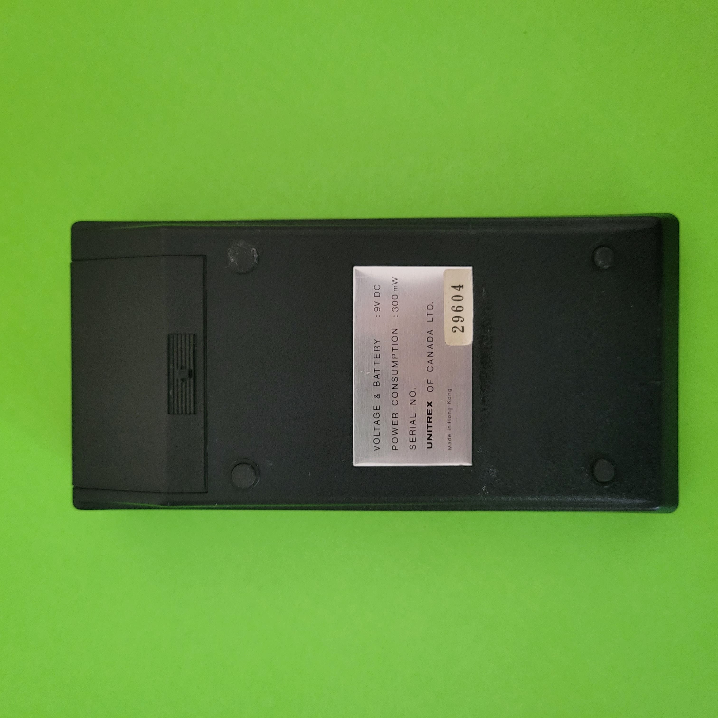 An image of the back of a Unitrex UC 75 Scientific/Engineering calculator